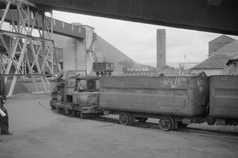 View from SE showing narrow-gauge surface locomotive with mine car