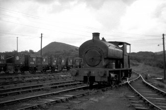 View showing locomotive with trucks in background