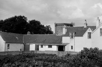 View from SE showing part of SSE half of windmill and surrounding buildings