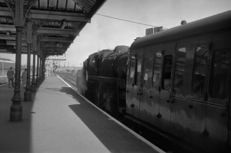 View looking WNW showing part of awning of down platform building with Ayr train on right