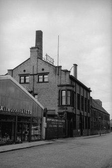 View from E showing NNE front and part of ESE front of NE block