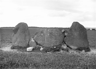 View of recumbent stone and flankers.
Original negative captioned: 'Remains of Stone Circle at South Leylodge, Kintore from South June 1904'.