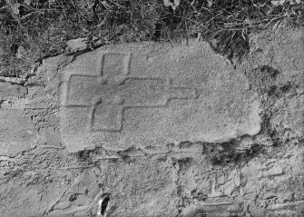 View of slab bearing incised outline of cross.
Original negative captioned: 'Old Cross in Wall at Seaton Road Aberdeen June 1919'.