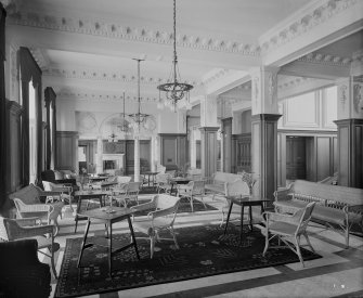 Turnberry Hotel entrance foyer with tables and cane chairs and sofas.