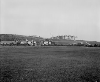 Distant general view of hotel with stable block? in foreground
