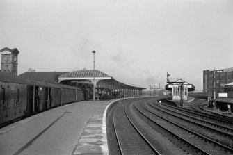 View looking W showing ESE and NNE fronts of awning of down platform building with island platform building on right