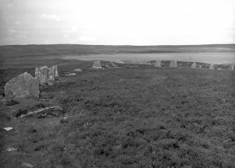 View of north end of horse-shoe shaped stone setting from the interior.
Original negative captioned: 'Achkinloch Stone Circle, Latheron, Caithness, Curved end. 1910'.