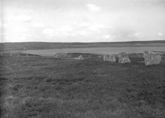 View of east side of horse-shoe shaped stone setting.
Original negative captioned: 'Achkinloch Stone Circle, Latheron, Caithness, East side 1910'.