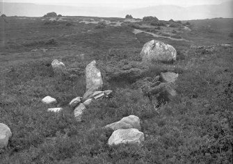 View of remains of chamber.
Original negative captioned: 'Cist at Stone Circle called Clachan Gorach i.e. "The Foolish Stones" nearly 5 miles North East of Strathpeffer 1907'.
