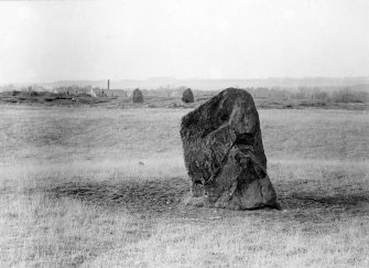 Northernmost stone of avenue, with henge and circle visible in background
