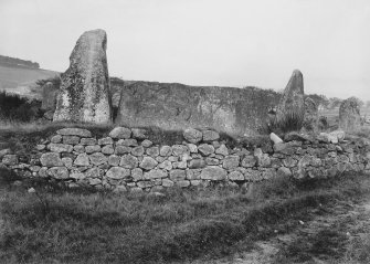 View of recumbent stone and pillars, from outside the circle to the south west.
