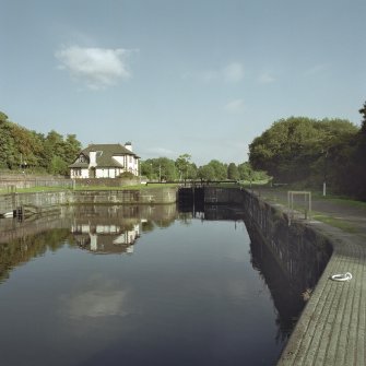View of basin and lock-keeper's house from west. Digital image of E/6453/CN.