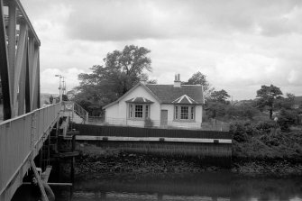 View from ESE showing ESE front of cottage with part of bridge on left