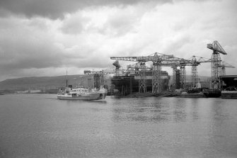 View from ESE showing John Brown's Shipyard (with QE II on stocks) with TSS Shieldhall passing