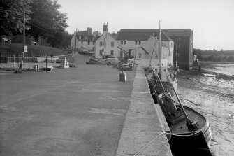 View looking WSW showing harbour with Harbour Cottage, Storehouse, The Old Granary and Warehouse in background