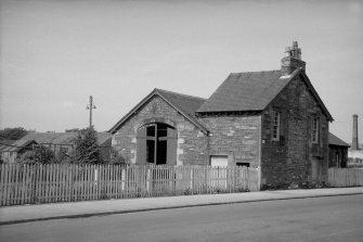 View from S showing SW front and part of SE front of engine shed and house