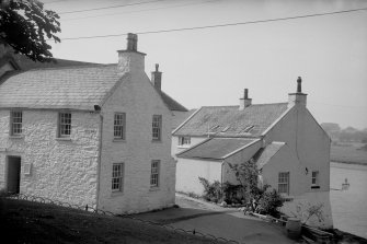 View from SE showing E front and part of S front of Shorehouse with part of Harbour Cottage in foreground