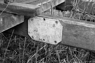 View showing name plate on handle of farm cart which is inscribes 'F M & G BATCHELOR No. 5 CRAIGIE HOME FARM'