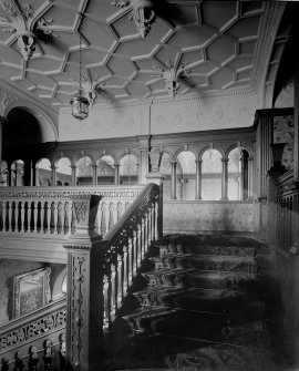 Interior view of staircase and colonaded landing

