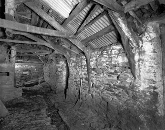 Byre, west wall showing surviving cruck-frames