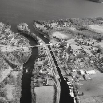 Scanned image of photograph showing oblique aerial view of Fort Augustus Locks, village and abbey