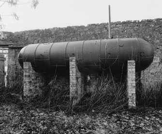 View of egg-end boiler (used as rain-water tank) situated at NW side of stables.