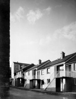 Photographic view of West terrace of stepped houses.

