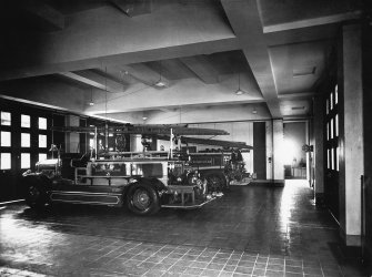 Photographic copy of interior photograph showing fire engines.