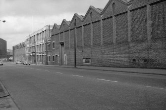 View from SE showing part of SSW front of numbers 477-519 Shettleston Road