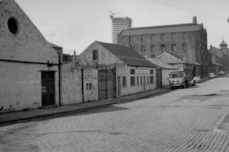 View from ENE showing N front of steel works with colour works in background