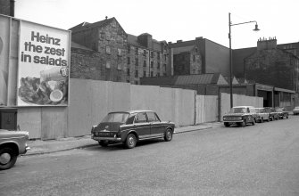 View from NNW showing part of WNW front of warehouses and part of NNE front of building