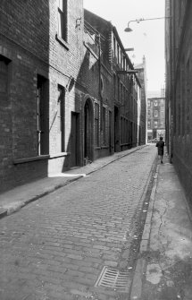 View looking S down Gorbals Lane showing workshop in background