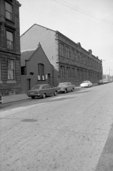 View from S showing ESE front of administration block (Harvie Street block) of tram depot with hall in foreground