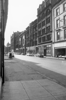 View from NW showing NNE front of Glass Warehouse with Leather Warehouse in foreground and former Church in background