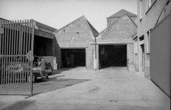 View from E (Hydepark Street) showing part of ESE front of weaving sheds