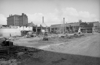 View looking NNW showing works being demolished with lodging house on left