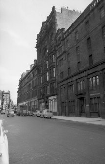 View from SW showing WNW front of warehouse with part of grain store in foreground and numbers 80-88 in background
