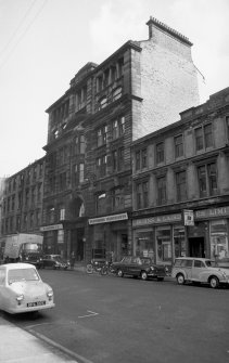 View from SSW showing WNW front of numbers 60-62 with numbers 68-72 in background and part of numbers 44-56 in foreground
