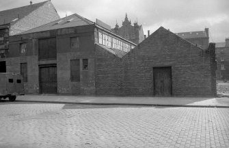 View from W showing WNW front of boat shed and store