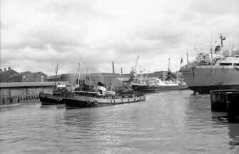 View looking ENE showing bulk ore carrier leaving General Terminus Quay