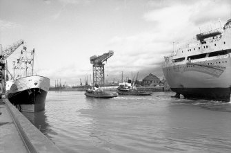 View looking NW showing bulk ore carrier leaving General Terminus Quay