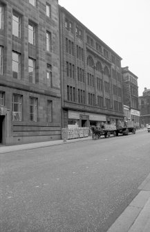 View from W showing horse lorry outside works with part of telephone exchange in foreground