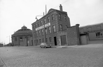 View from SSE showing SSW front and part of ESE front of offices with N lift building in background