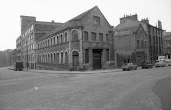 View from SE showing SW and ESE fronts of works with engineering works on left and number 10 and tenement on right