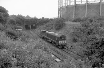 View looking W showing English Electric Type 1 Diesel with bridge on left and part of gasholder on right