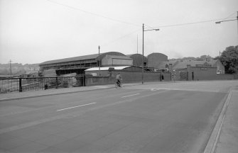 View from SSW showing top of bridge with sawmill in background