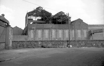 View from SW showing remains of central (E) block