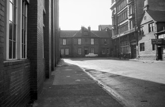 View from N showing NNW front of offices with part of stationery works and number 22 on right
