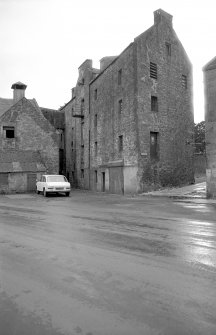 View from NNE showing N front and part of E front of granary block with part of mill on left