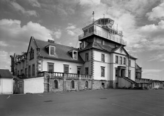 View of front facade of house with control tower.